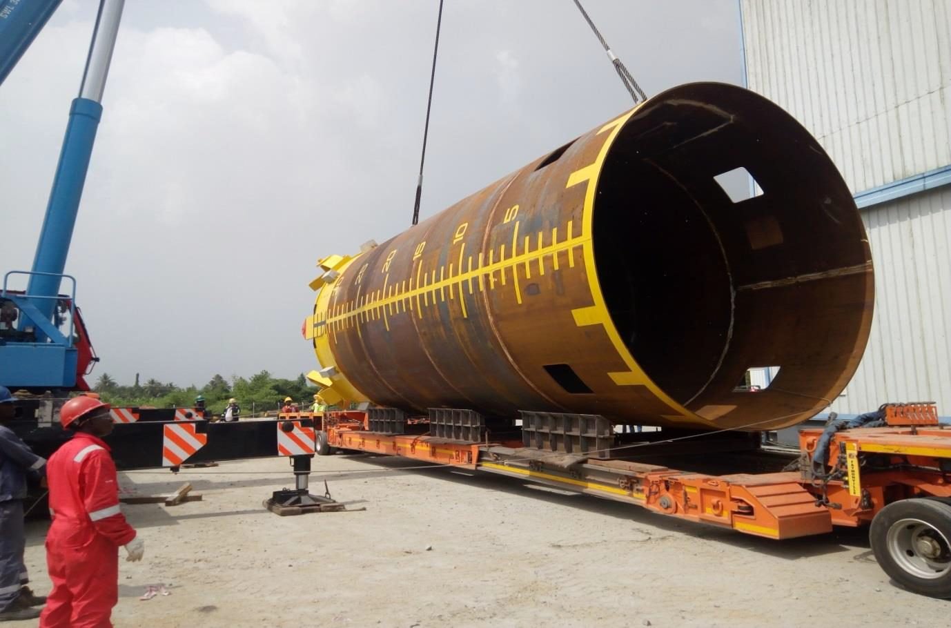 Large steel cylinder loaded on a multi-axle trailer