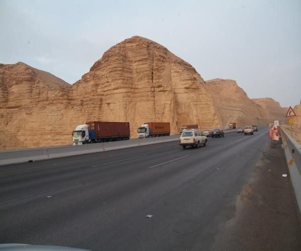 Trucks crossing a mountain highway